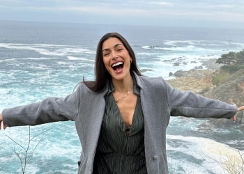 Nikki Howard wearing Grey suit with black shirt